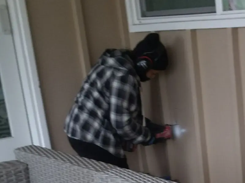 Professional electrician installing an exterior outlet in Bothell West